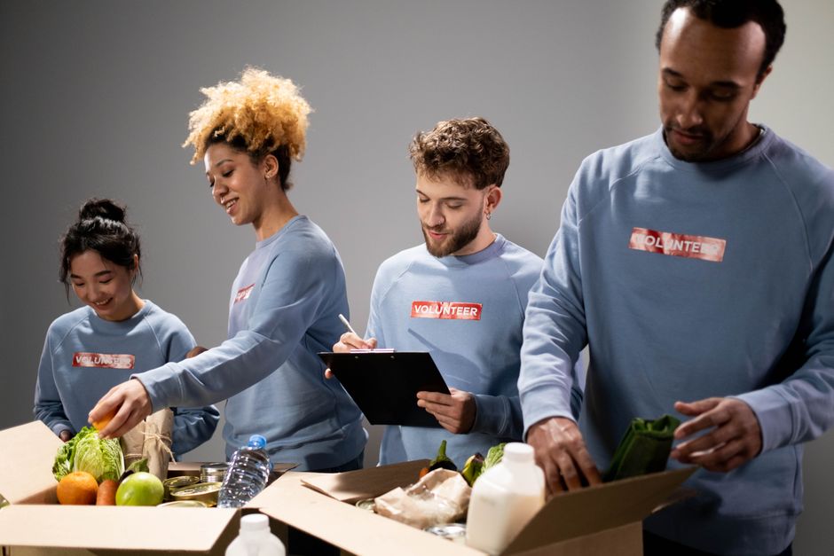 Volunteers packing grocery boxes at a food pantry